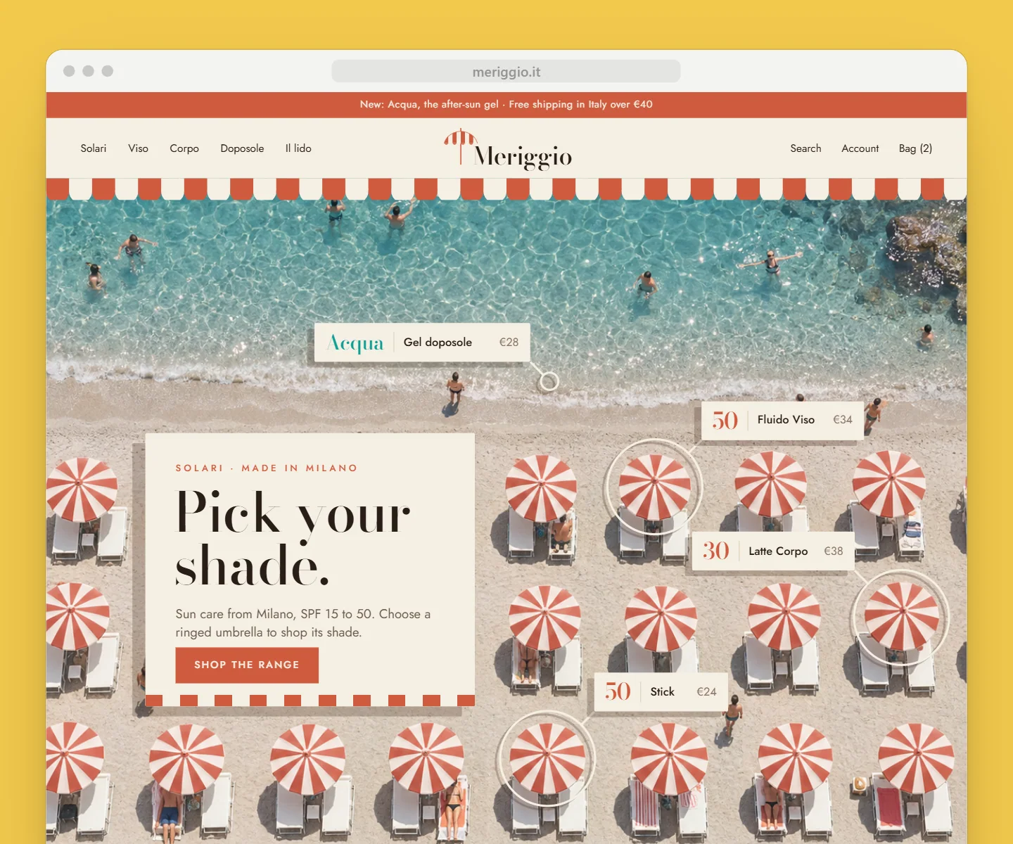 The Meriggio shop in a browser on sun yellow: the nav under a striped scalloped awning over the whole lido from above, the turquoise sea at the top and rows of striped umbrellas; "Pick your shade." on a linen card laid on the sand among them, and four products tagged where they belong: three ringed umbrellas with their SPF, and the new Acqua after-sun at the water’s edge
